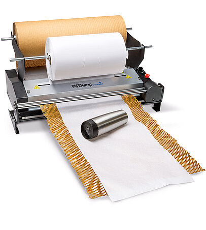 
			A paper machine produces brown and white paper for packaging
