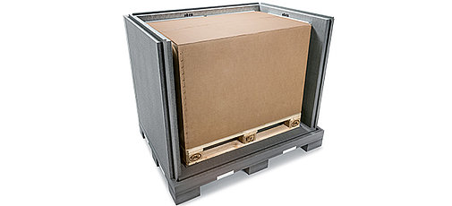 A black insulated container with an inner carton and cooling elements on a pallet