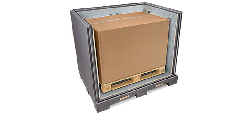 A grey insulated container with an inner carton and cooling elements on a pallet 
