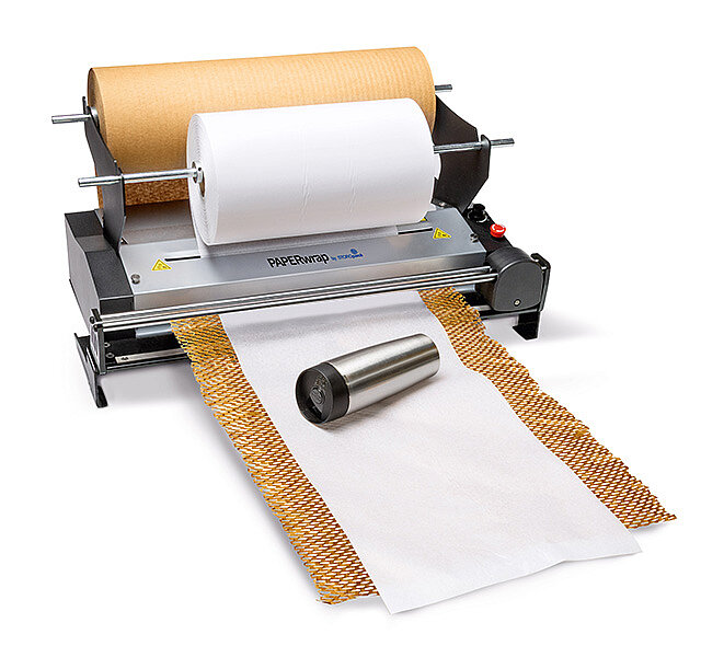 
			A paper machine produces brown and white paper for packaging
