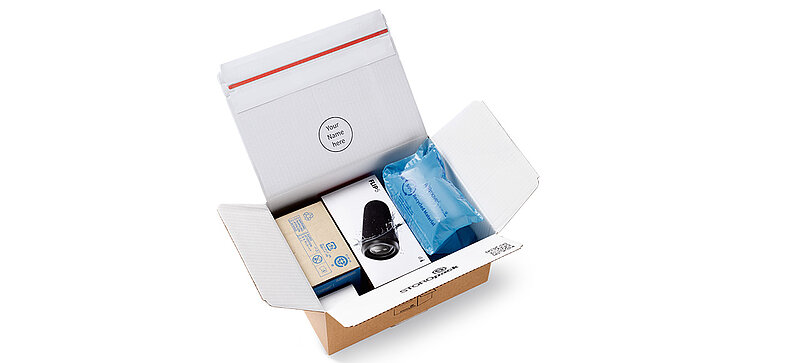 Open cardboard box with protective air cushions